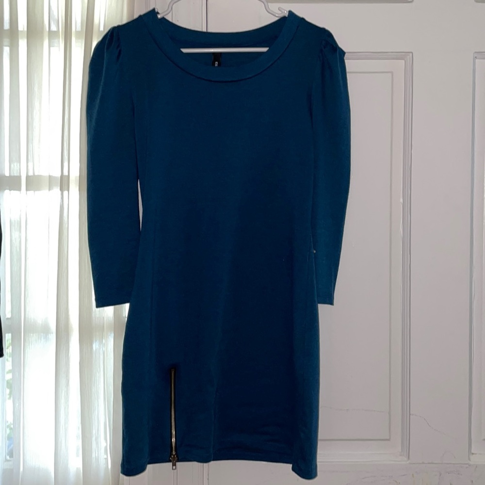 Be bold in this dark blue body con dress! Would pair nicely with boots or heels!